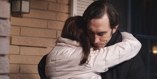Consoling his daughter.